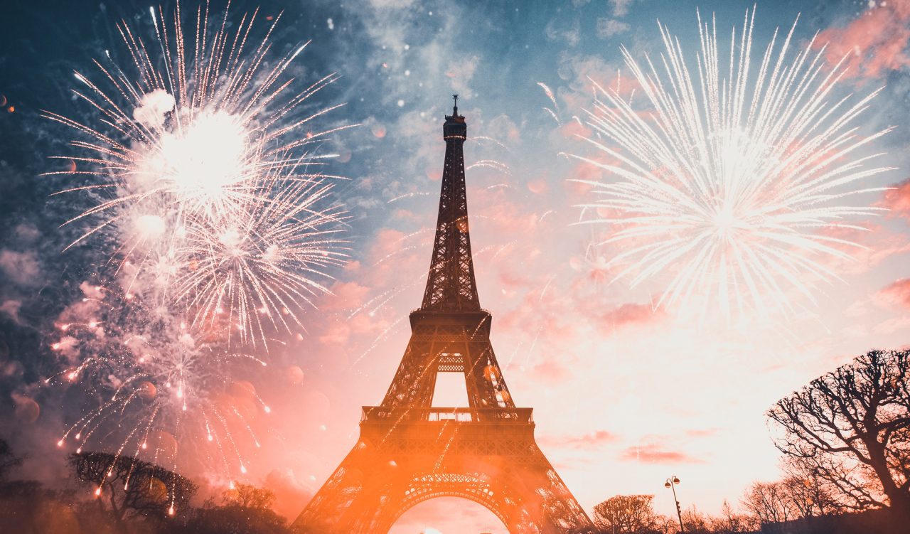 eiffel tower paris france with fireworks celebrating new year in the city.jpg